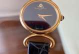 Baume & Mercier (1830),  - Relógio Suiço feminino da marca - Baume Mercier em ouro 18 kt e pulseira de lezard. Funcionando perfeitamente