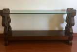 Console de madeira nobre estilo colonial brasil... - Console de madeira nobre estilo colonial brasileiro com prateleira de vidro e platô inferior ligador por laterais recortadas. Retirada no apt na...