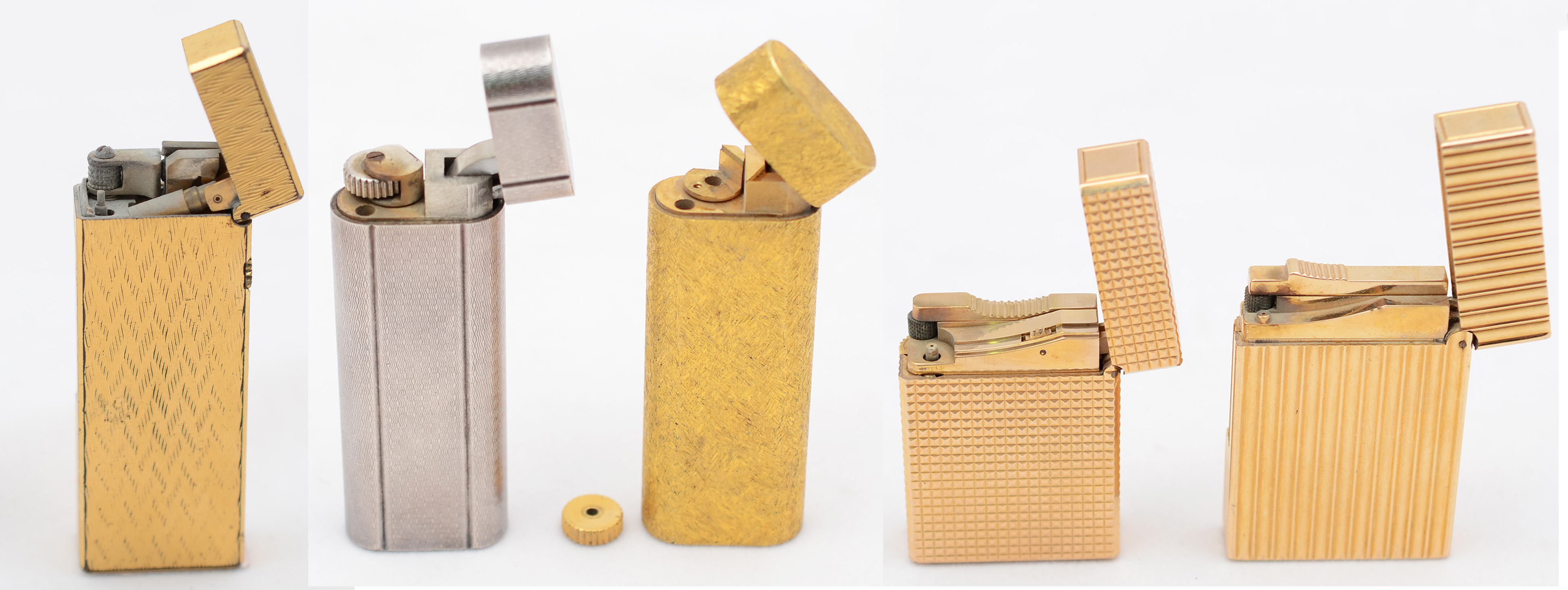 Cinco isqueiros diversos, sendo 2 DUPONT, 2 CARTIER e um DUNHILL... - foto 1 de 4