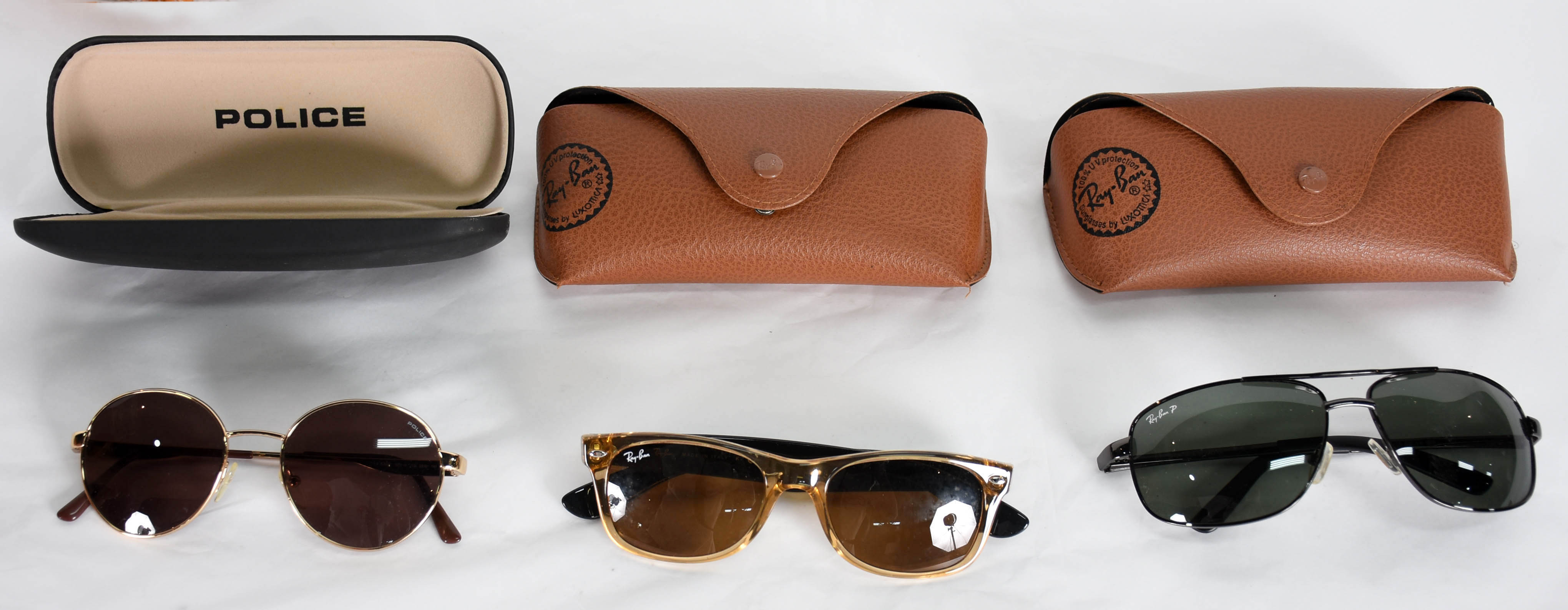 Tres óculos de sol diversos, sendo 2 Rayban e 1 Police. - foto 1 de 5