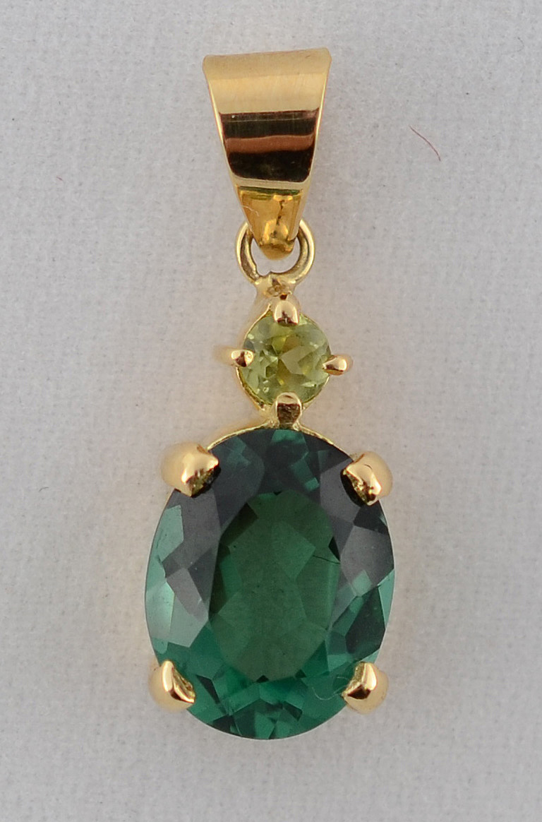 Pingente de ouro 18 k com turmalina lapidação oval de aproximadamente... - foto 1 de 2