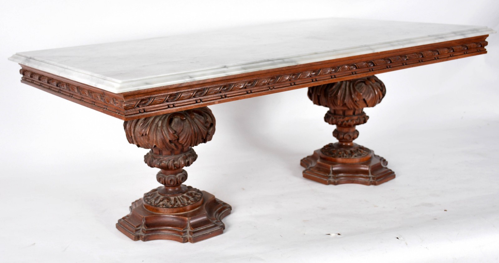 Mesa de centro de madeira nobre trabalhada com tampo de mármore. - foto 1 de 4