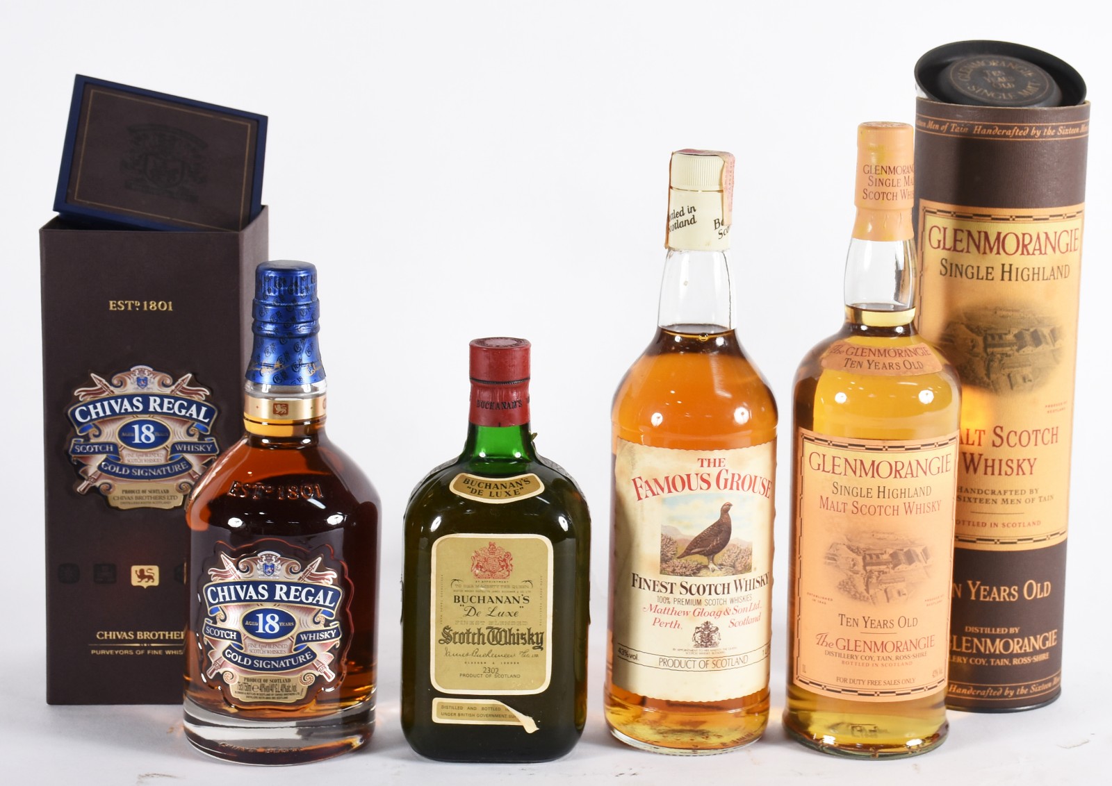 Quatro garrafas de whisky, sendo: Glenmorangie 10 anos, Buchanan's... - foto 1 de 4