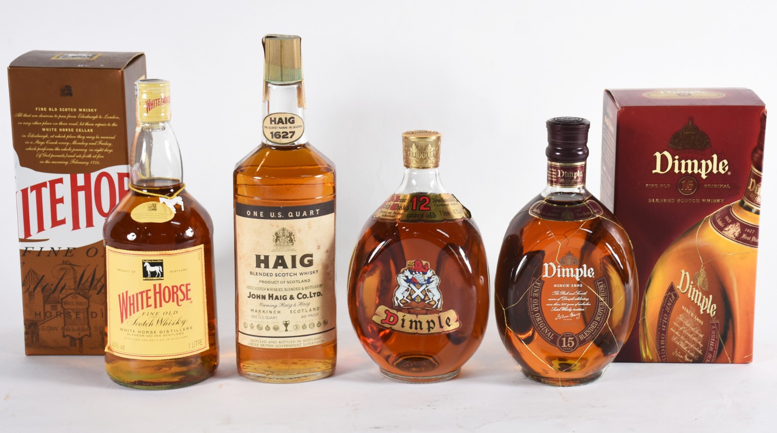 Quatro garrafas de whisky, sendo: 2 Dimple, White Horse, Haig. - foto 1 de 4