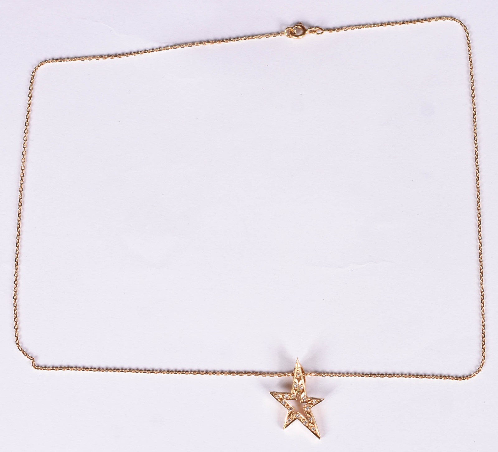 Gargantilha de ouro 18 k com pingente feitio estrela com 12... - foto 2 de 4