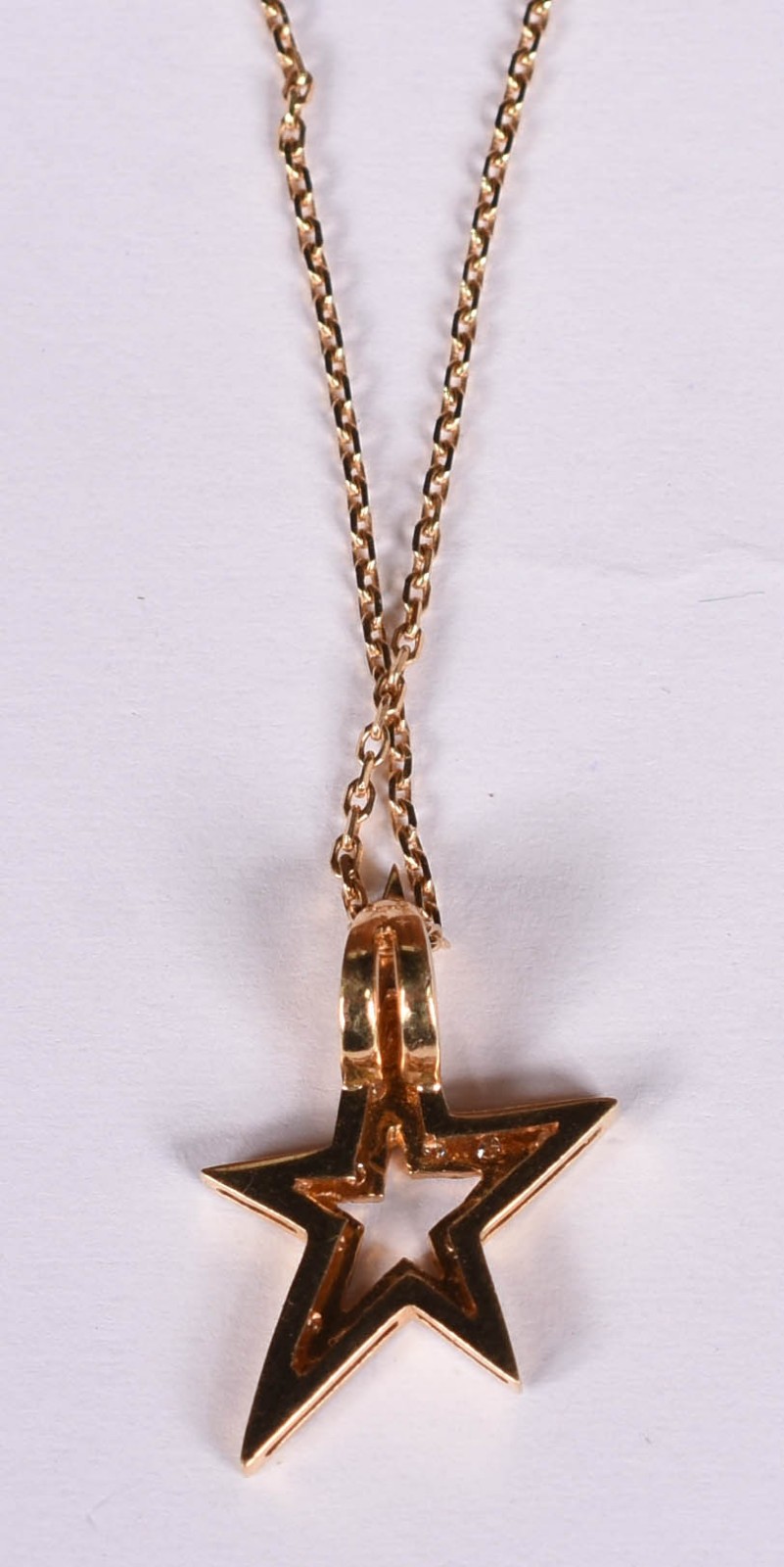 Gargantilha de ouro 18 k com pingente feitio estrela com 12... - foto 4 de 4