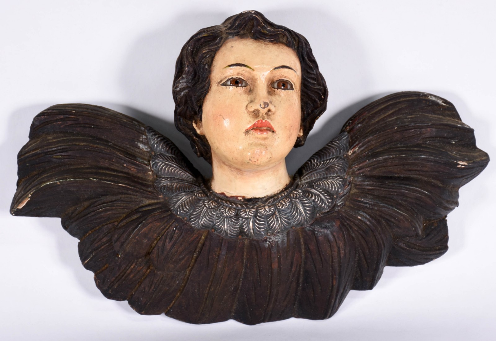 Cabeça de anjo de madeira com olhos de vidro. - foto 1 de 3
