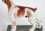 Estatueta de porcelana policromada representand... - Estatueta de porcelana policromada representando cachorro