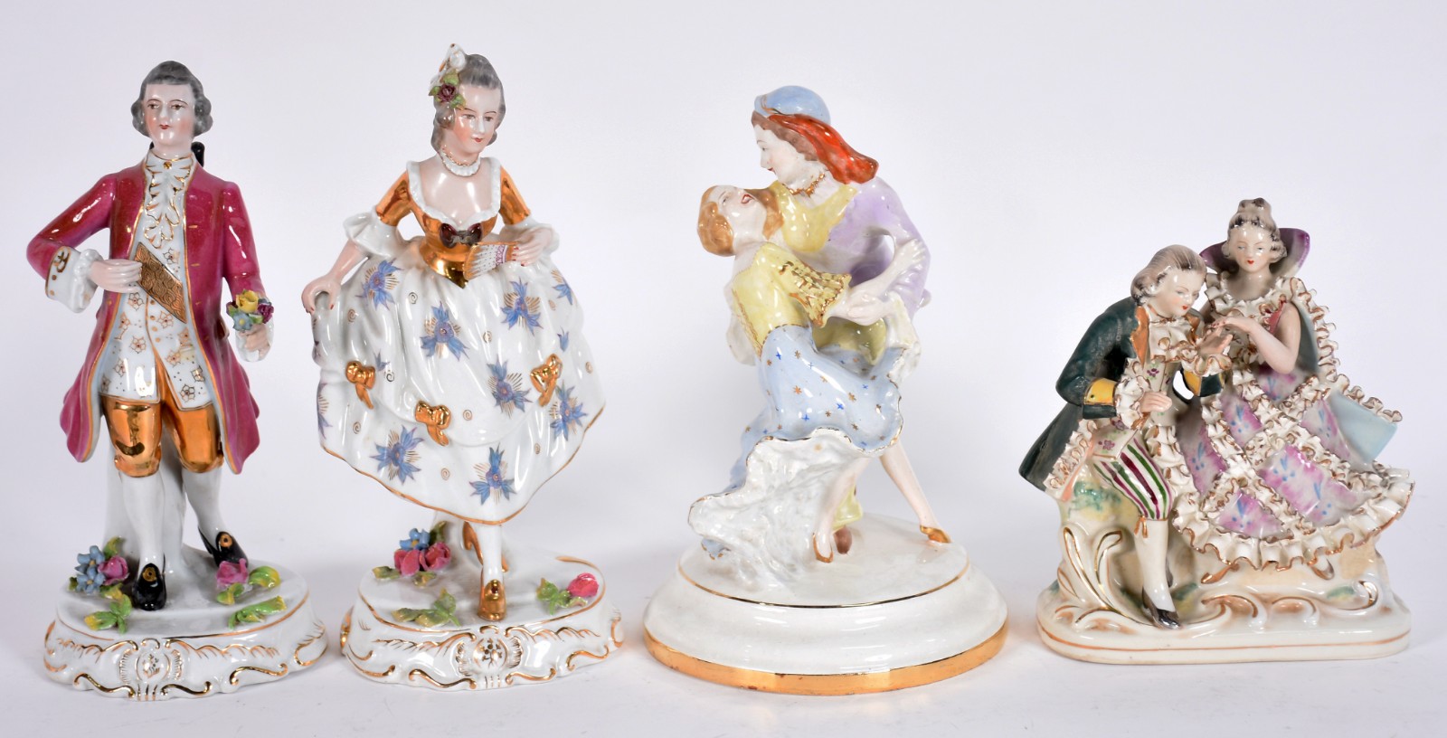 Quatro estatuetas diversas de porcelana policromada. - foto 1 de 7