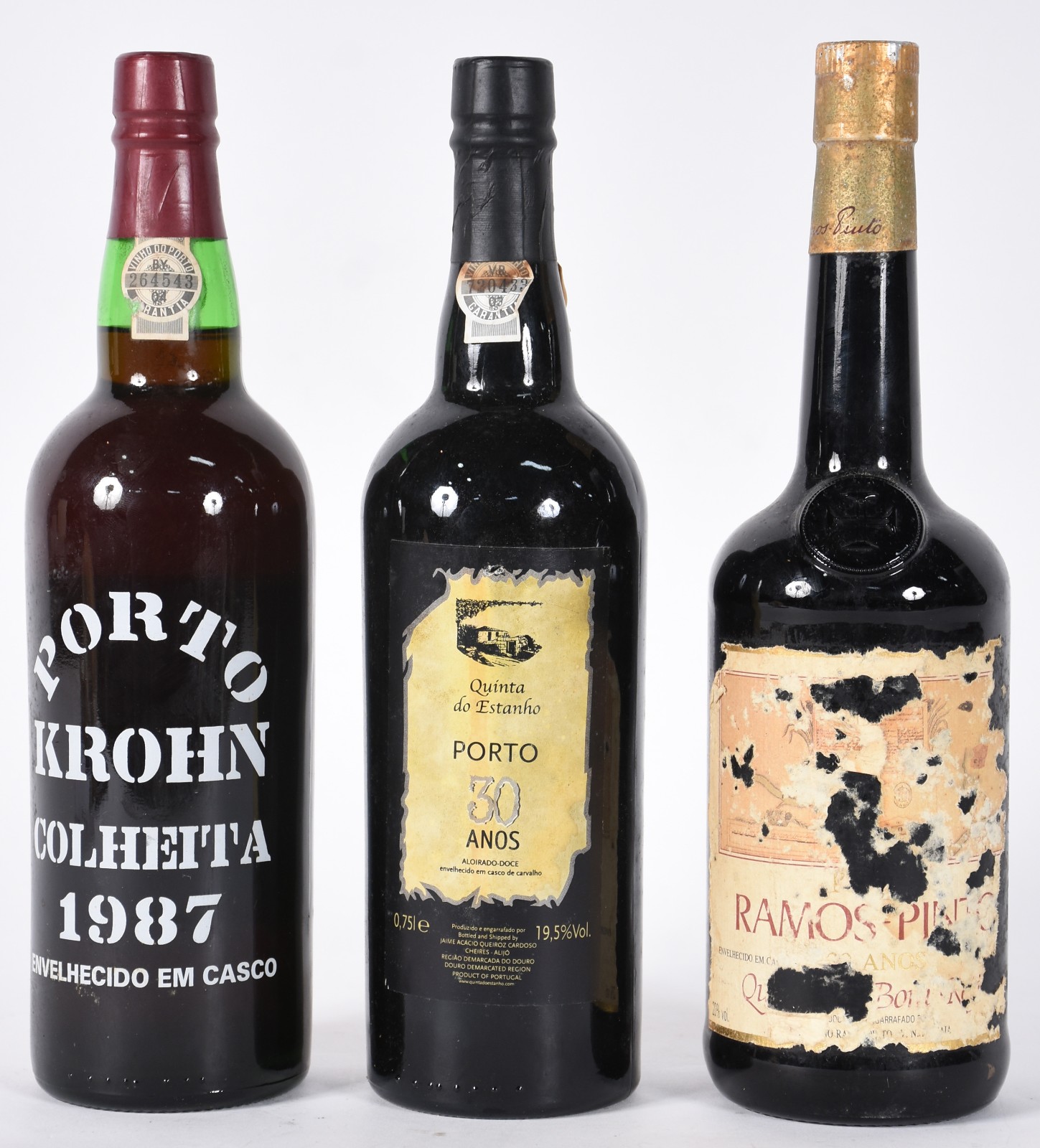 Três garrafas de vinho do Porto, sendo Porto Krohn colheita 1987... - foto 1 de 7