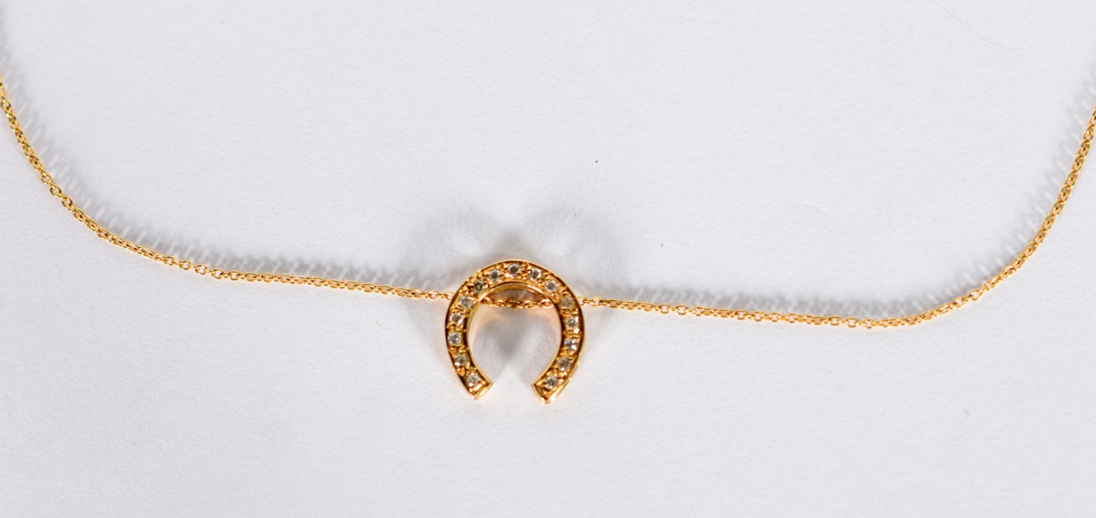 Cordão com pingente no feitio de ferradura de ouro 18 k com 13... - foto 1 de 4