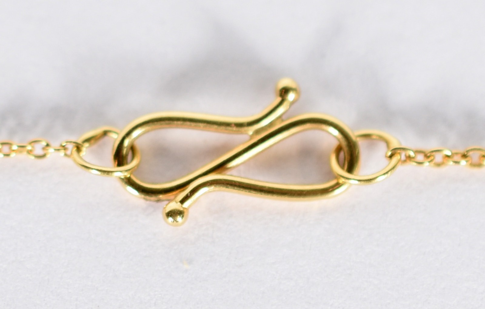 Cordão com pingente no feitio de ferradura de ouro 18 k com 13... - foto 4 de 4