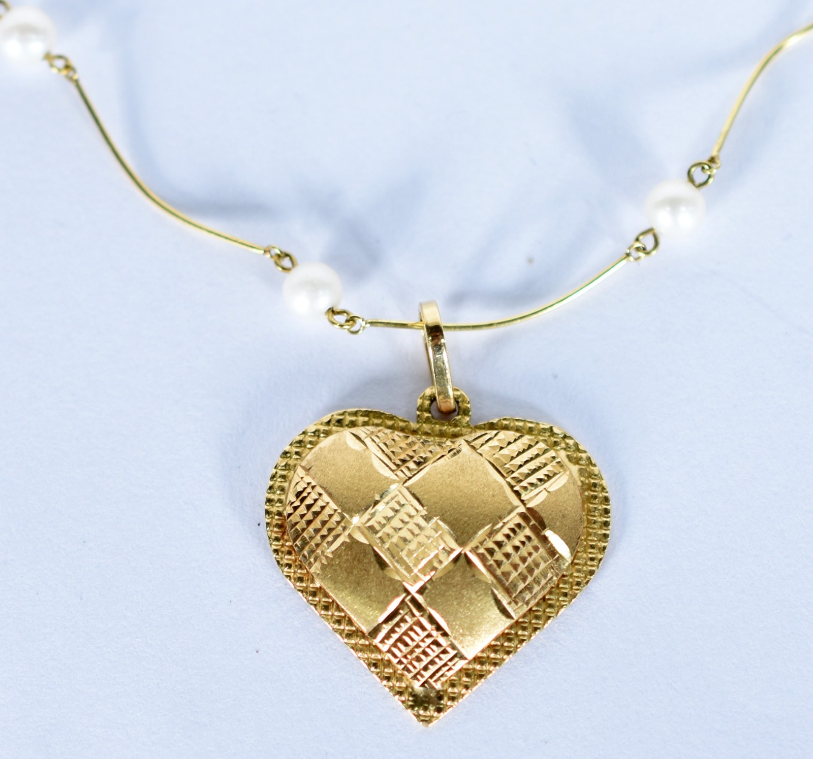 Colar de ouro amarelo 18 k com pérolas intercaladas e pingente no... - foto 1 de 4