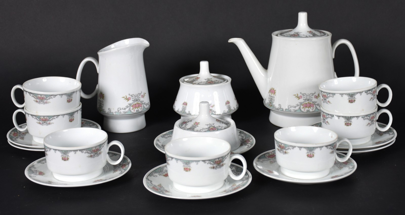 Serviço de café de porcelana Schmidt composto de 7 xícaras com pires... - foto 1 de 3