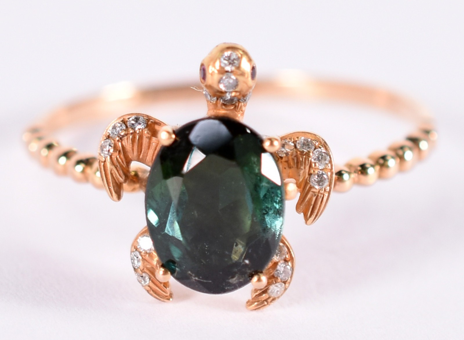 Anel de ouro 18 k feitio tartaruga com 1 turmalina oval verde tendo... - foto 1 de 3