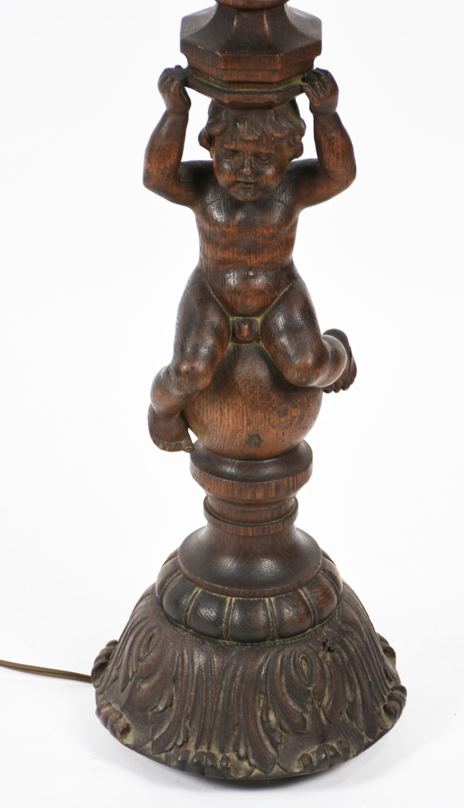 Tocheiro de madeira nobre com figura de menino sobre base circular... - foto 1 de 6