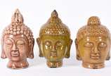 Três cabeças pequenas de cerâmica representando... - Três cabeças pequenas de cerâmica representando Buda.