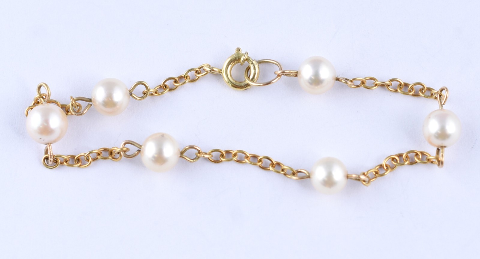 Pulseira em ouro 18 k, feitio corrente com 6 perolas brancas ( Por... - foto 1 de 3