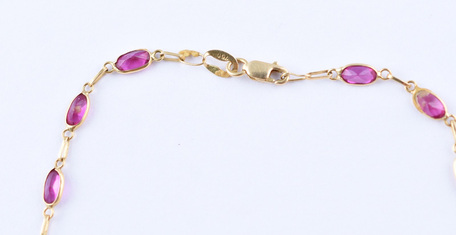 Tornozeleira de ouro 18 k com pedras vermelhas (Por motivos de... - foto 2 de 4
