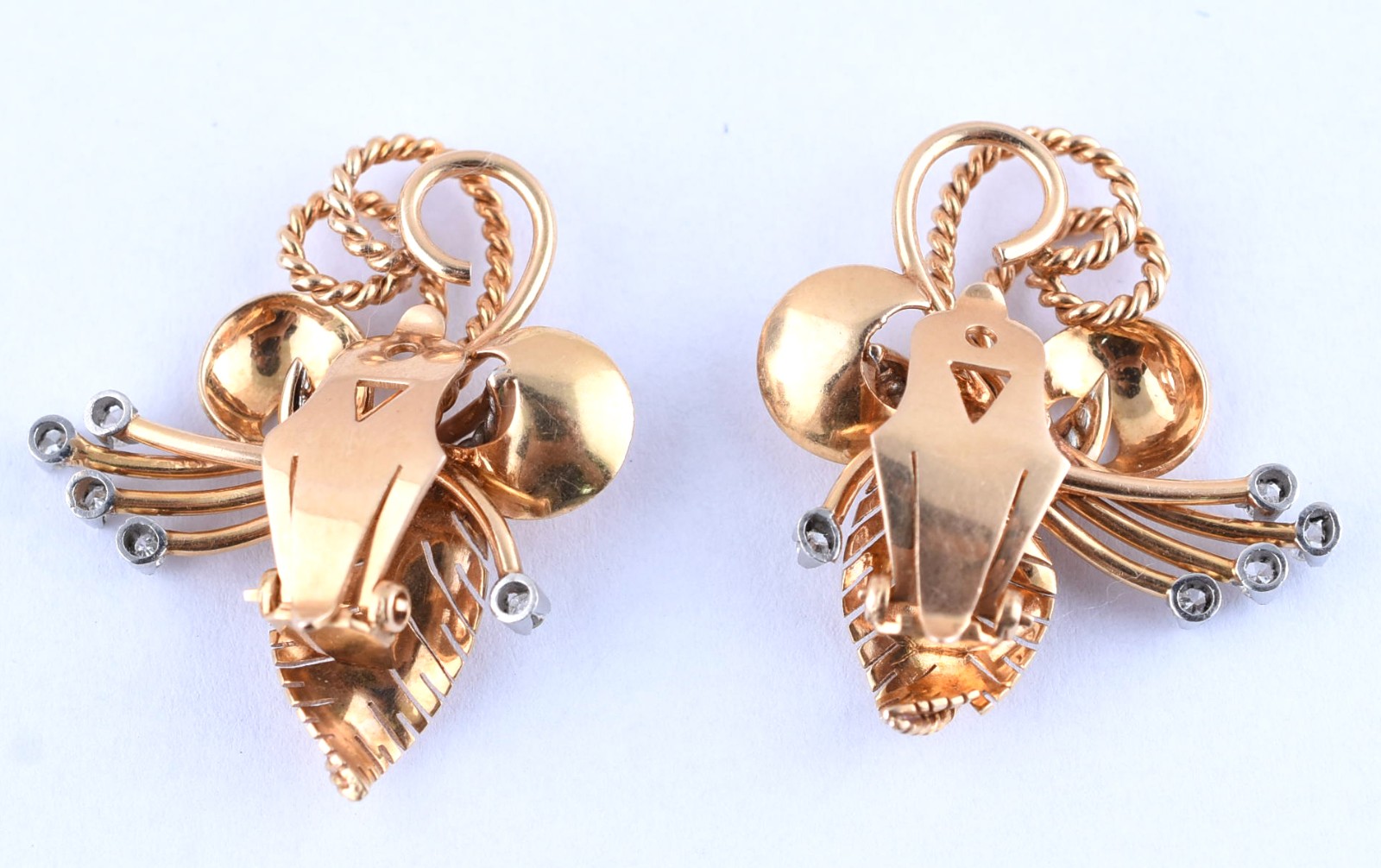 Par de brincos de ouro 18k de pressão com detalhes cravejados de... - foto 2 de 3