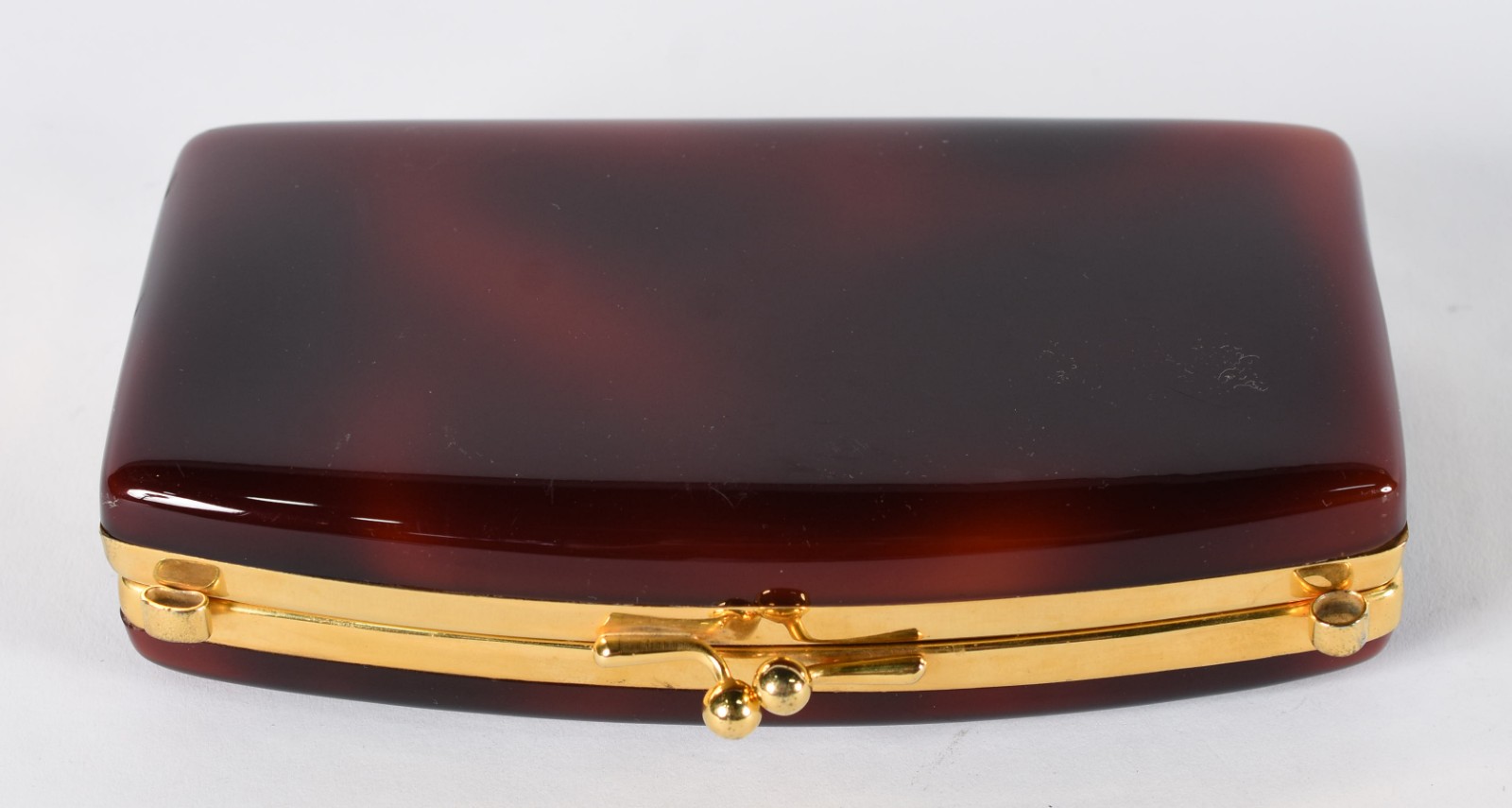 Bolsa clutch de material sintético "tartaruga" e metal dourado... - foto 1 de 5