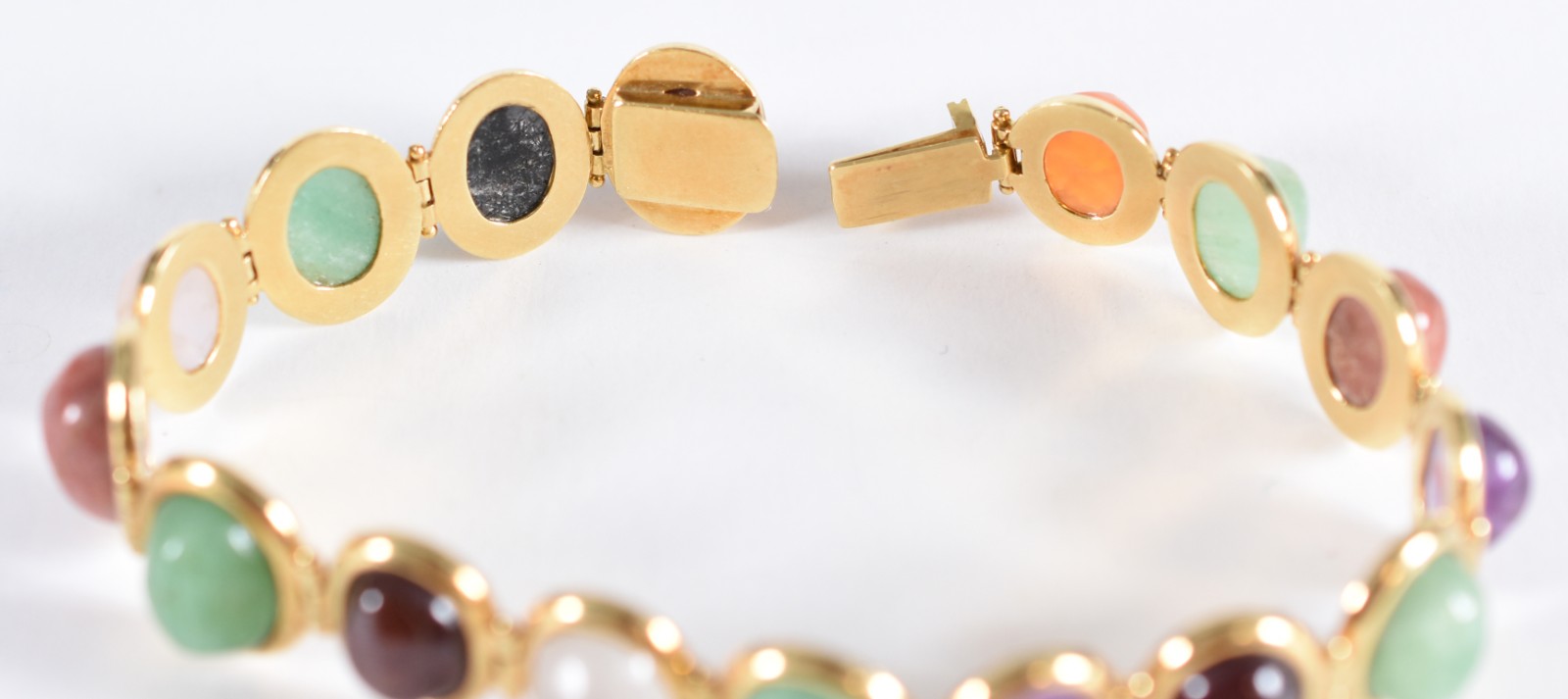 Pulseira em ouro 18 k, contrastada 750, com 16 pedras cabochon... - foto 2 de 6