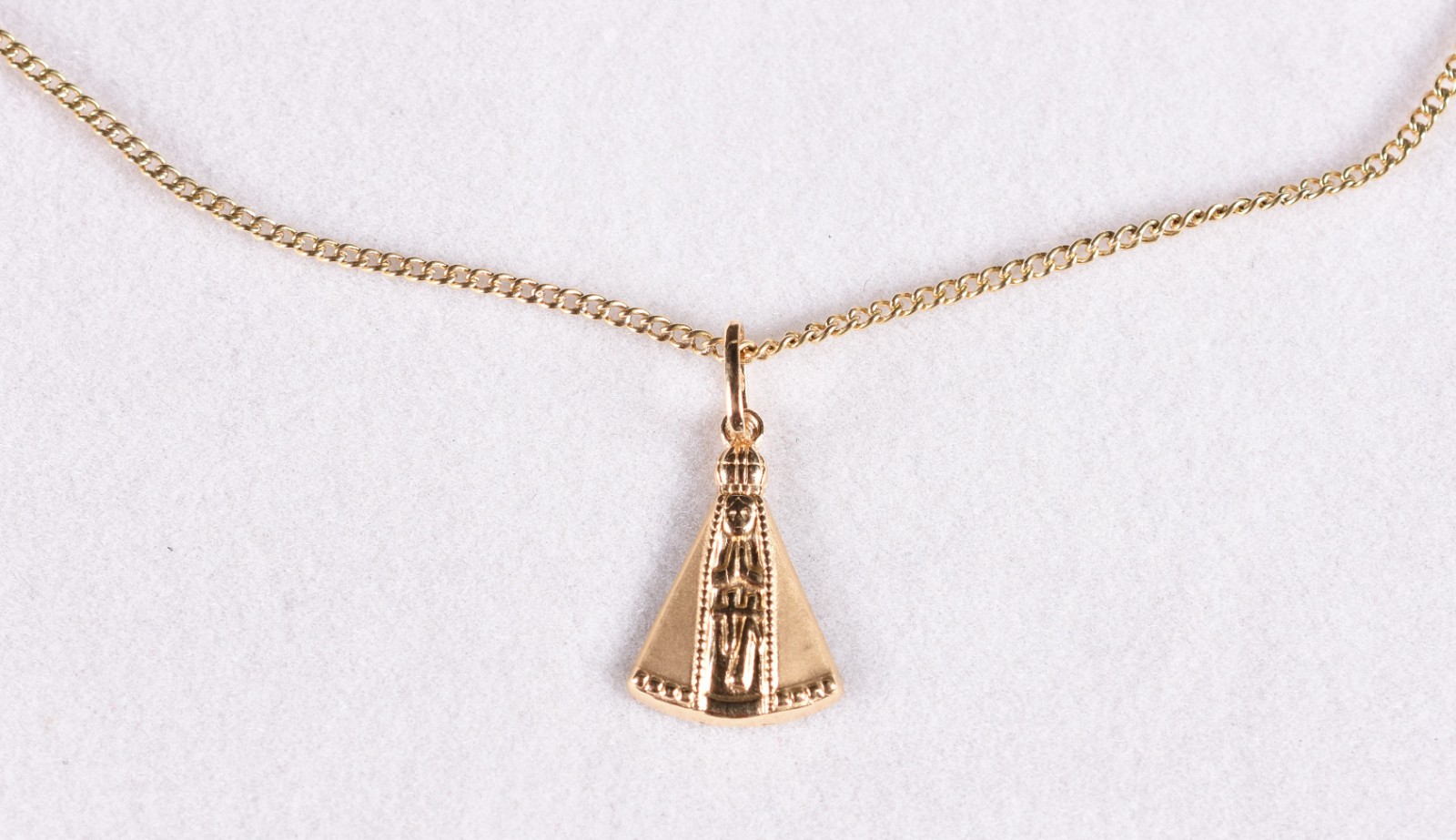 Cordão de ouro 18 k, contraste 750 com pingente de Nossa Senhora de... - foto 1 de 5