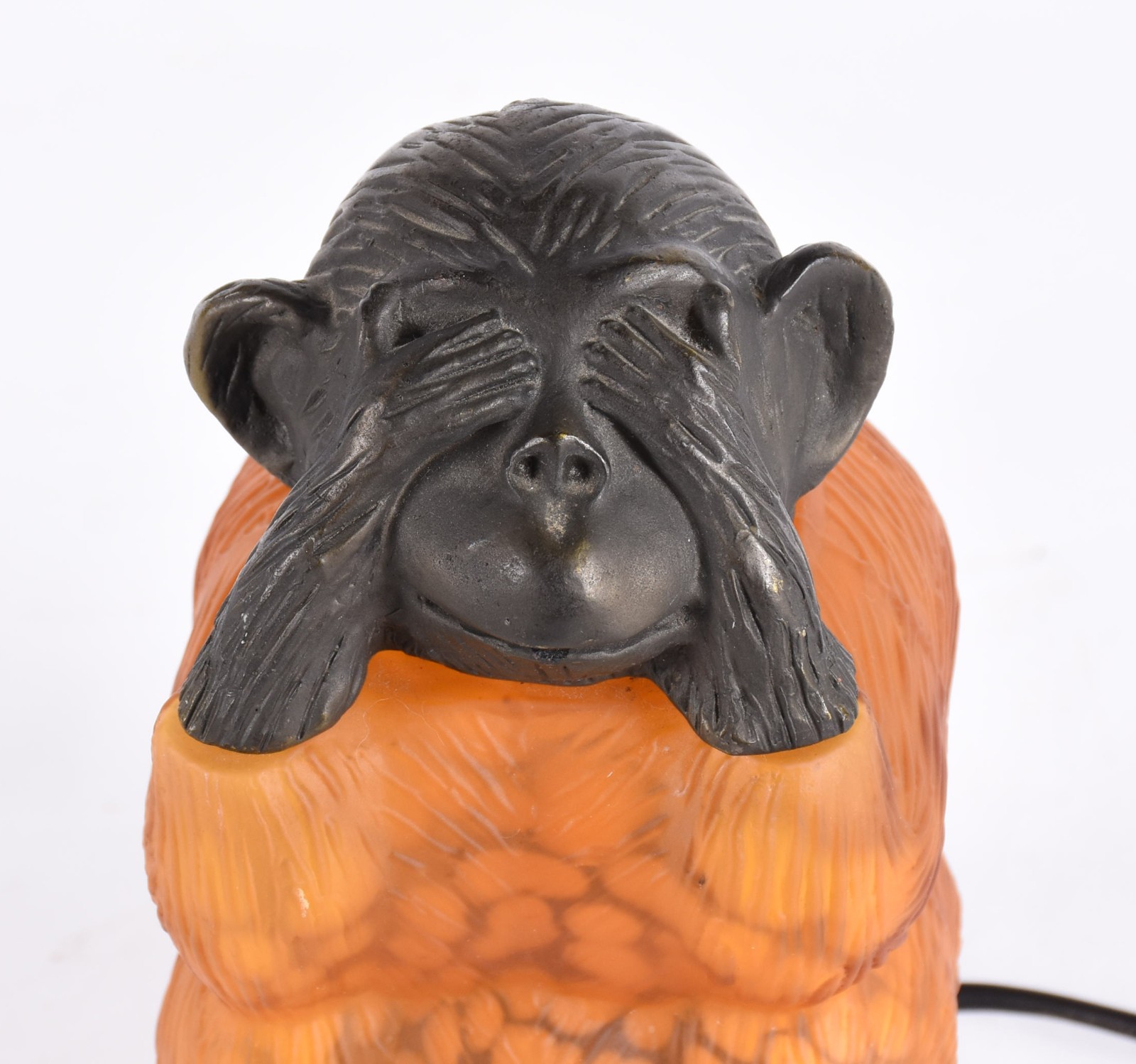 Luminária na forma de "macaco" em metal e vidro na cor âmbar. - foto 2 de 6