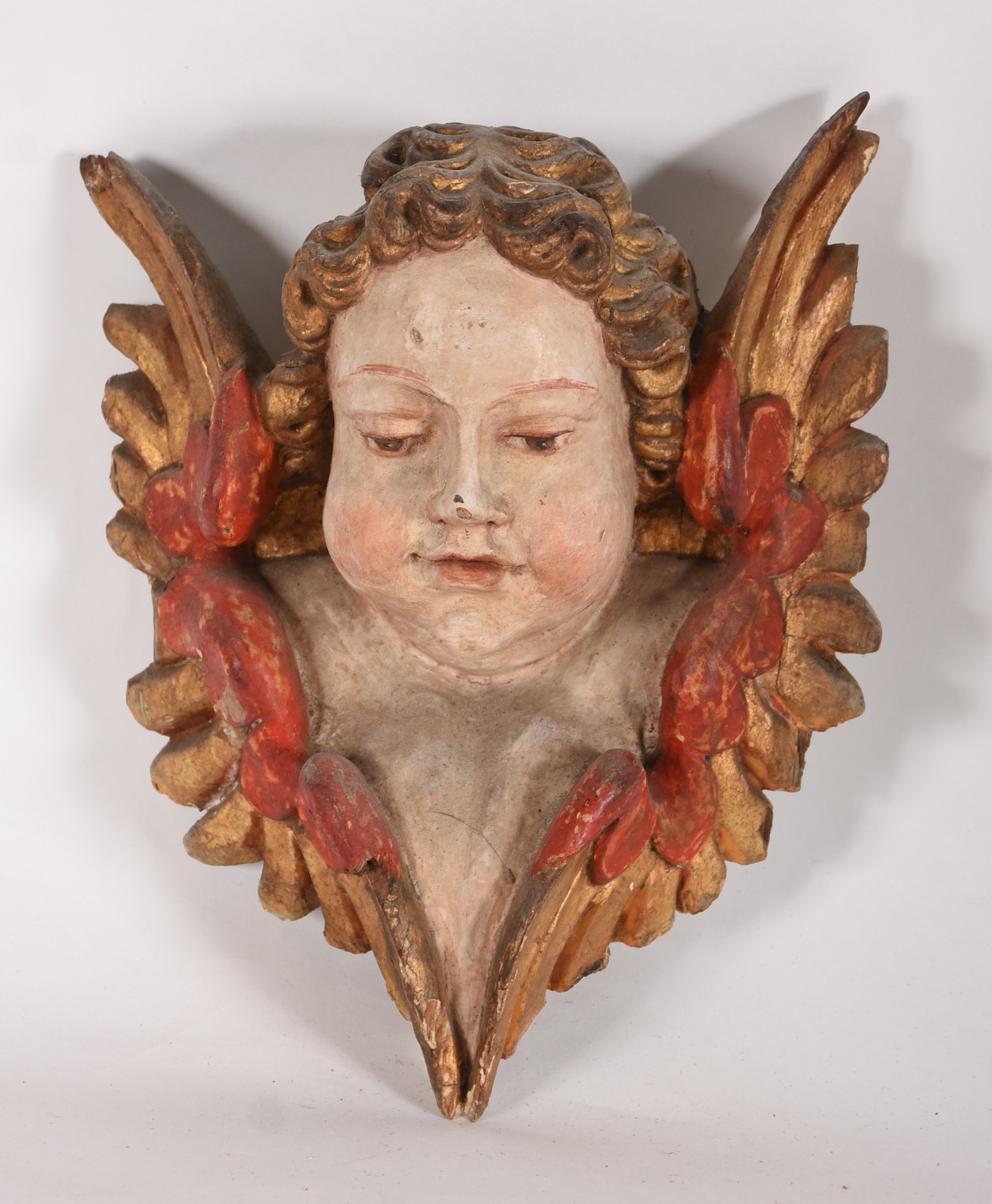 Cabeça de anjo de madeira policromada, século XIX. - foto 1 de 4