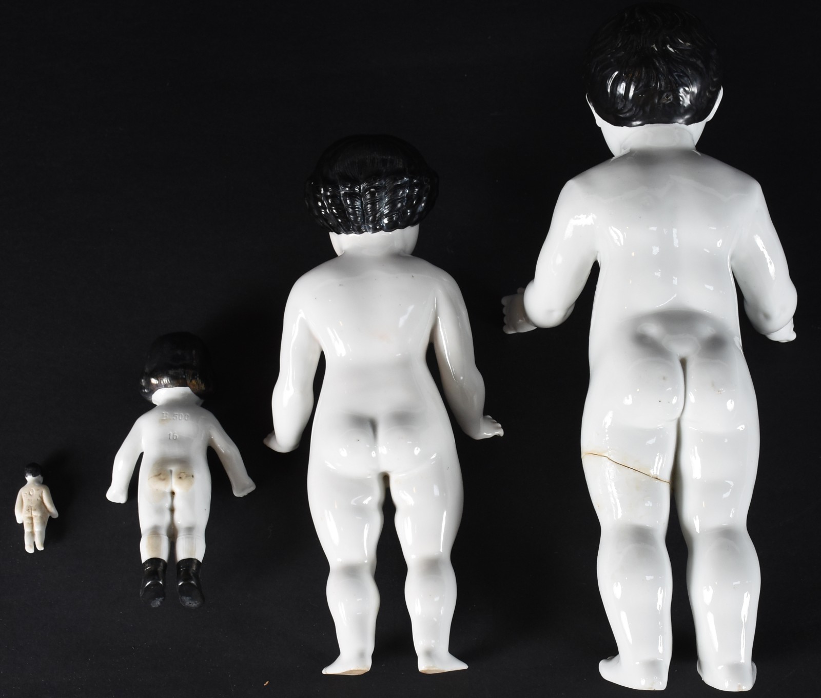 Quatro bonecas de porcelana policromada representando "Família"... - foto 8 de 9