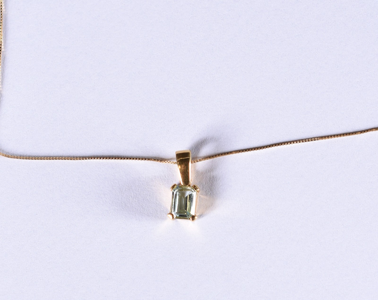 Cordão de ouro 18 k com pendente com pedra azul (Por motivos de... - foto 1 de 5