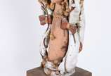 ARTE POPULAR,  - Estatueta representando Figura feminina de cerâmica vitrificada assinada M.O.,  base de madeira.