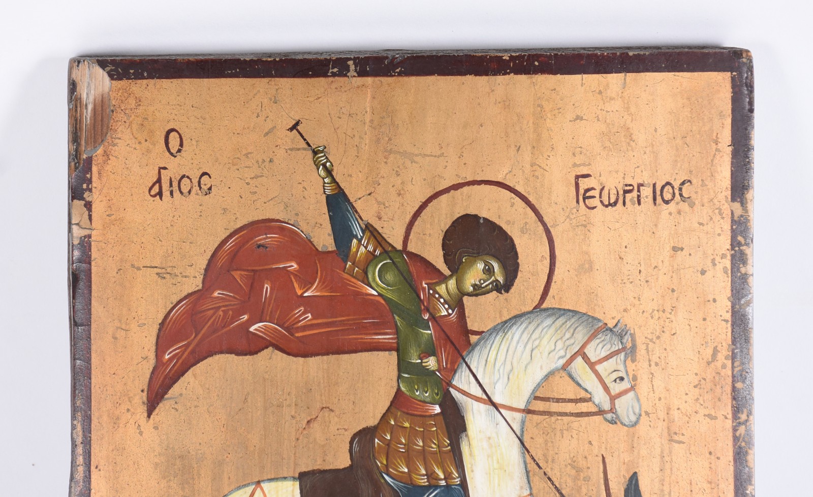 Ícone de madeira com figura policromada representando São Jorge com... - foto 2 de 3