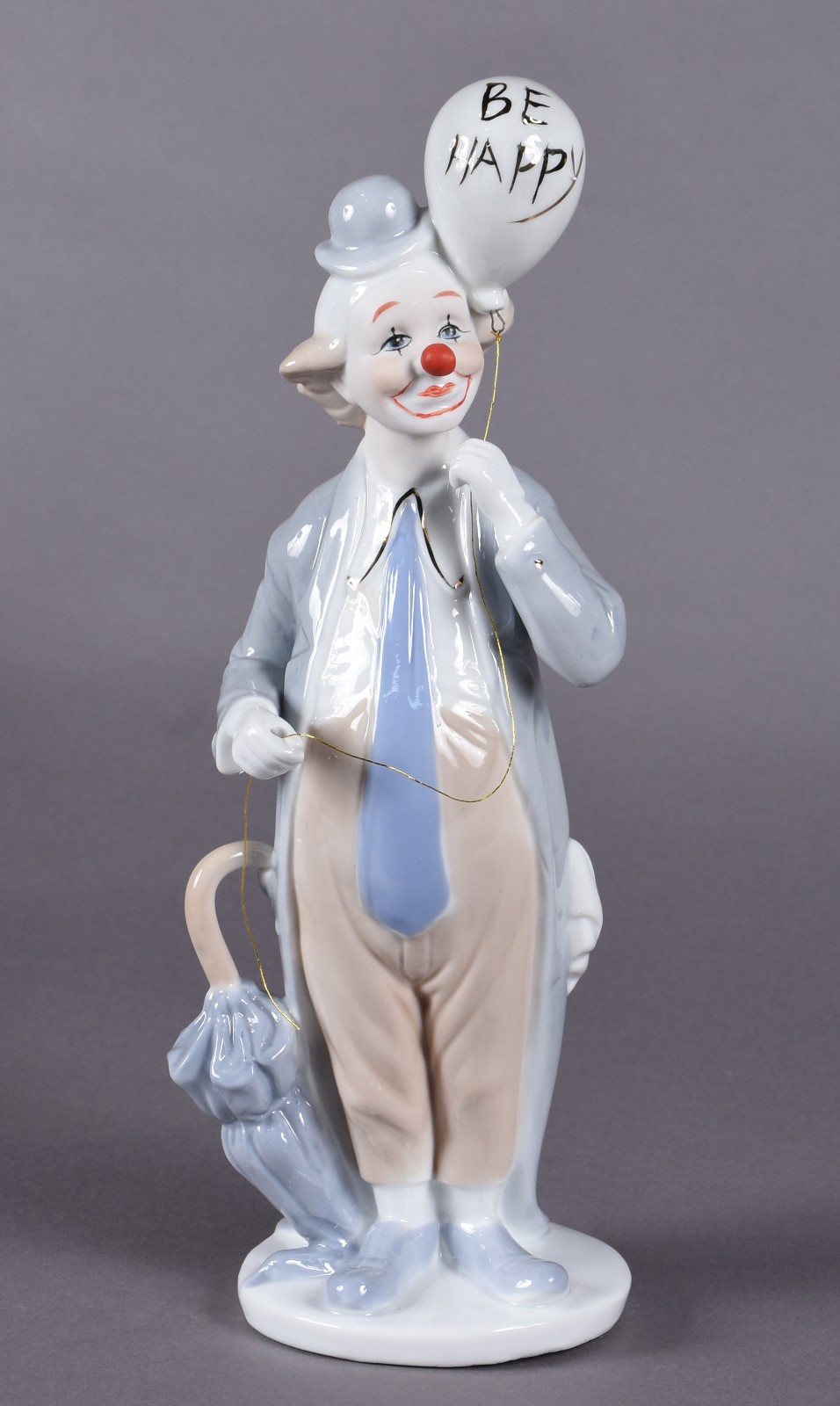 Estatueta de porcelana policromada representando palhaço. - foto 1 de 4