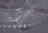 Baccarat (1764),  - Fruteira de cristal frances lapidado, feitio oval, bordas em gomos, base separada com quatro pés recurvos, fundo com estrela. Pequenos bicados.