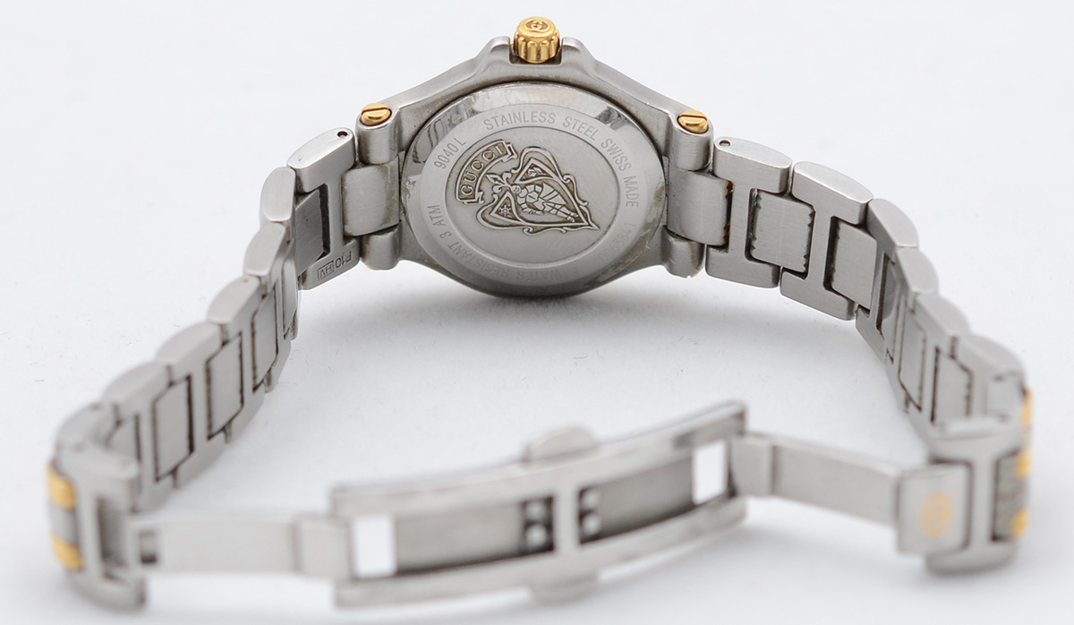 GUCCI - Relógio com pulseira em aço e ouro. Mostrador claro, com... - foto 3 de 4