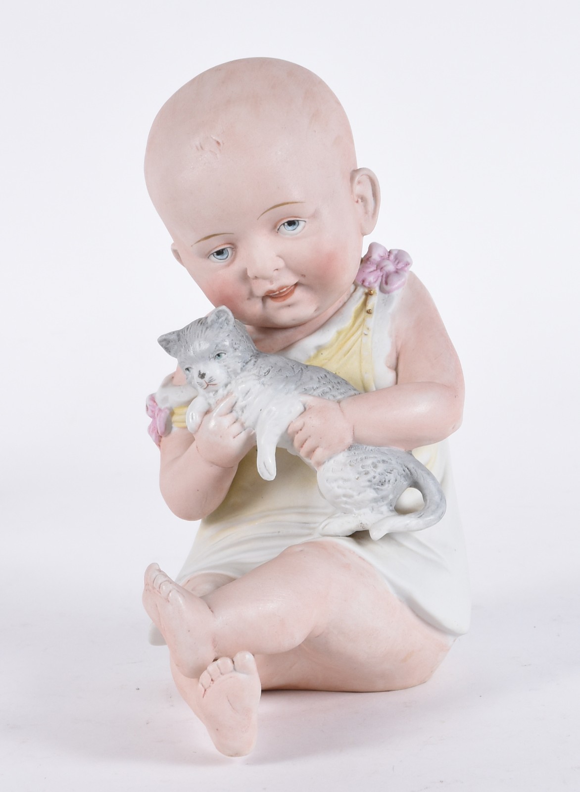 Escultura representando "Bebê com gatinho" de biscuit alemão... - foto 1 de 6