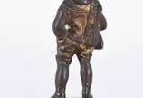 Georges OMERTH (1895/1925), Boy dressed in a wi... - Escultura de bronze com rosto de marfim, assinada.