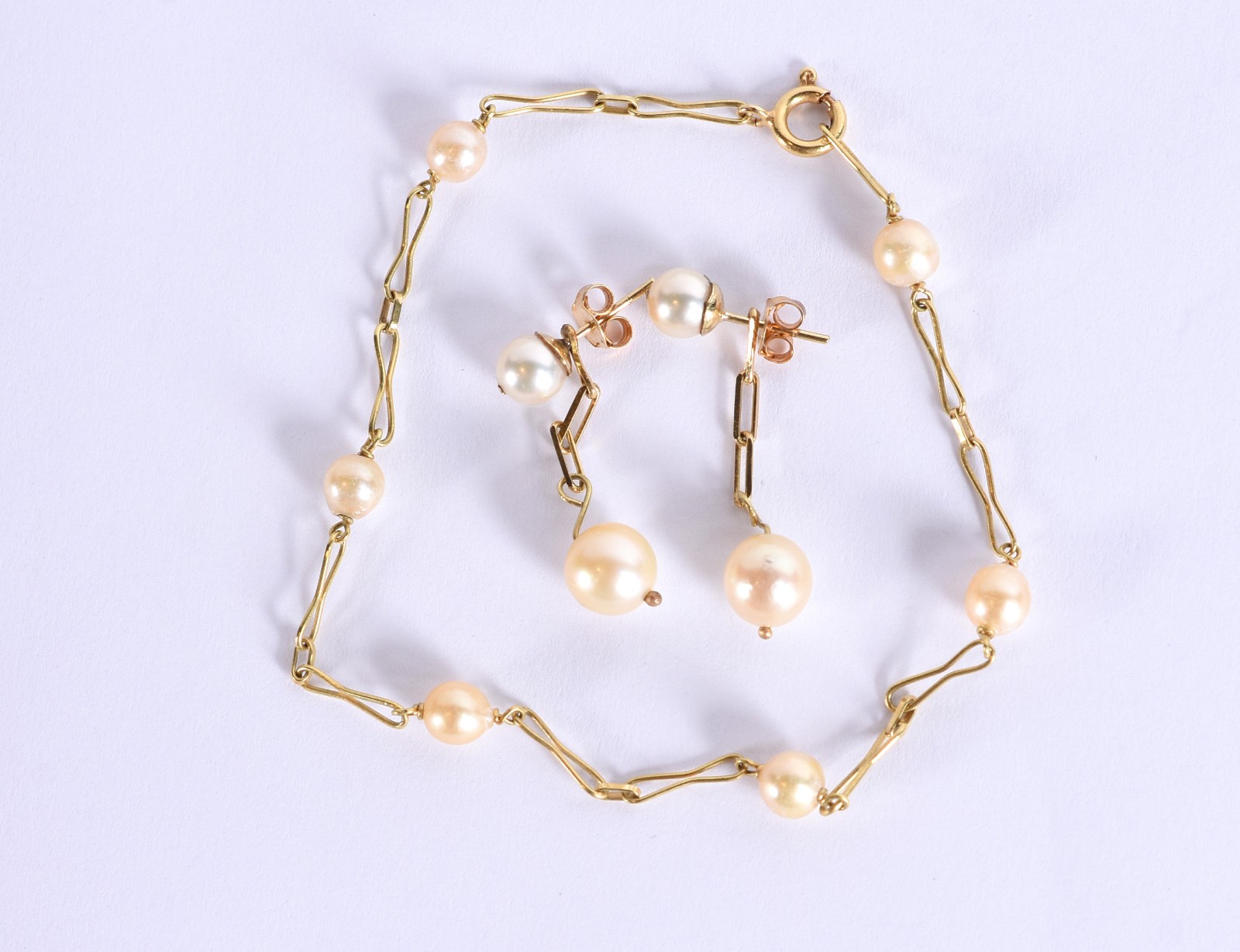 Conjunto de ouro 18k composto de pulseira com 6 perolas e par de... - foto 1 de 4