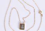 Cordão de ouro 18k com um pendente com relevo d... - Cordão de ouro 18k com um pendente com relevo do coração de Jesus  (Por motivos de segurança a peça não se encontra na loja)