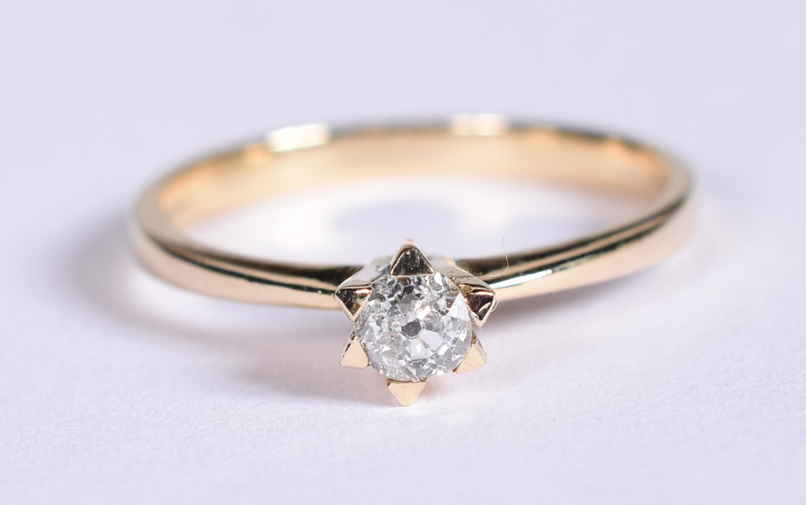 Solitário de ouro 18k contraste 750 com um brilhante, aro (Por... - foto 1 de 3