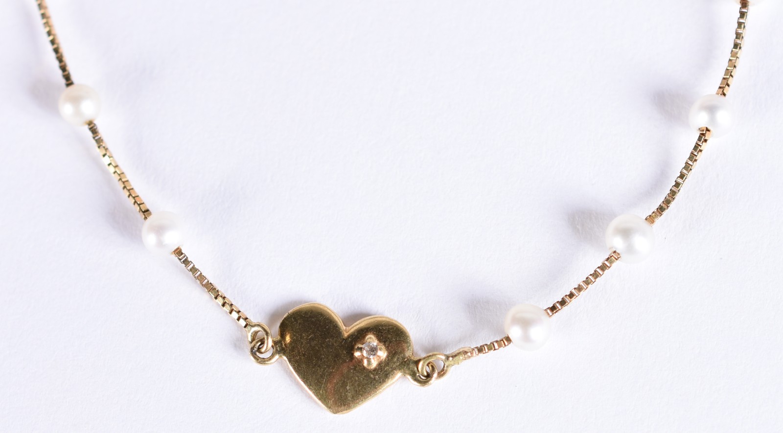 Pulseira de ouro 18k, contraste 750 com mini perolas e um brilhante... - foto 1 de 4