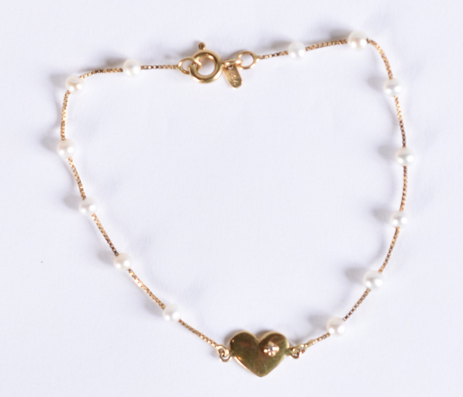 Pulseira de ouro 18k, contraste 750 com mini perolas e um brilhante... - foto 2 de 4