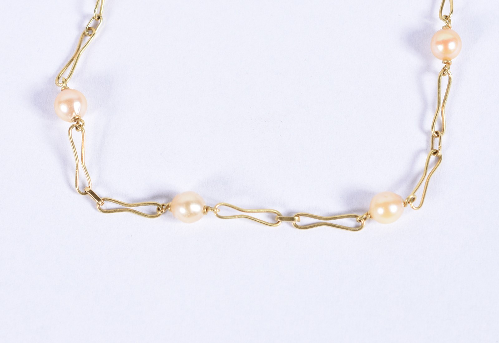 Pulseira de ouro 18k com 6 perolas intercaladas com 2 élos em forma... - foto 1 de 3