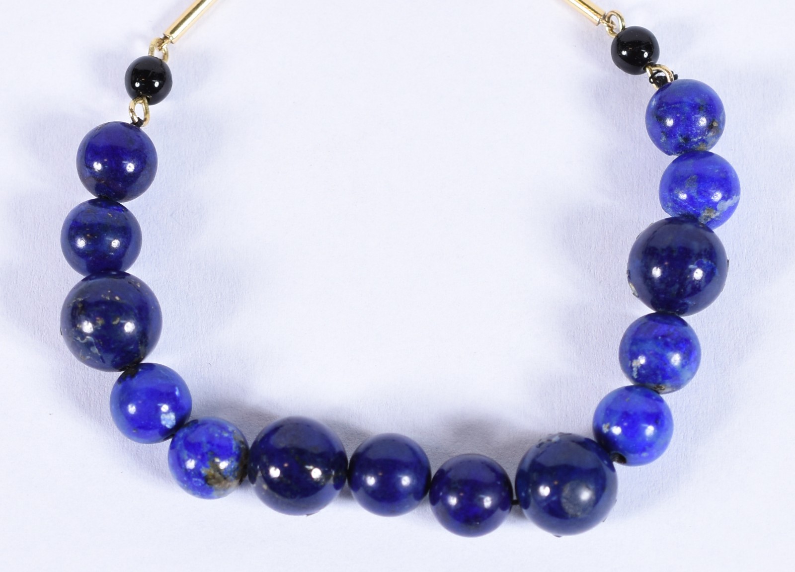 Pulseira com complementos em tiras e fecho de ouro 18k com 4 bolas... - foto 1 de 4