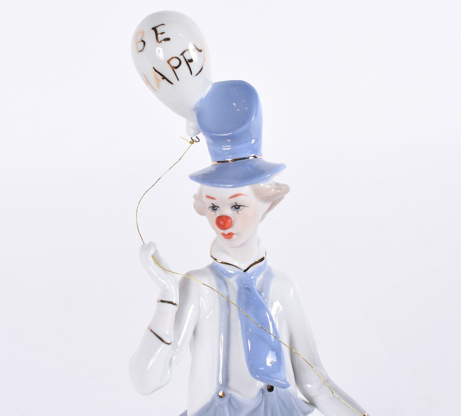 Duas peças, sendo: escultura de porcelana representando cacatua em... - foto 2 de 5