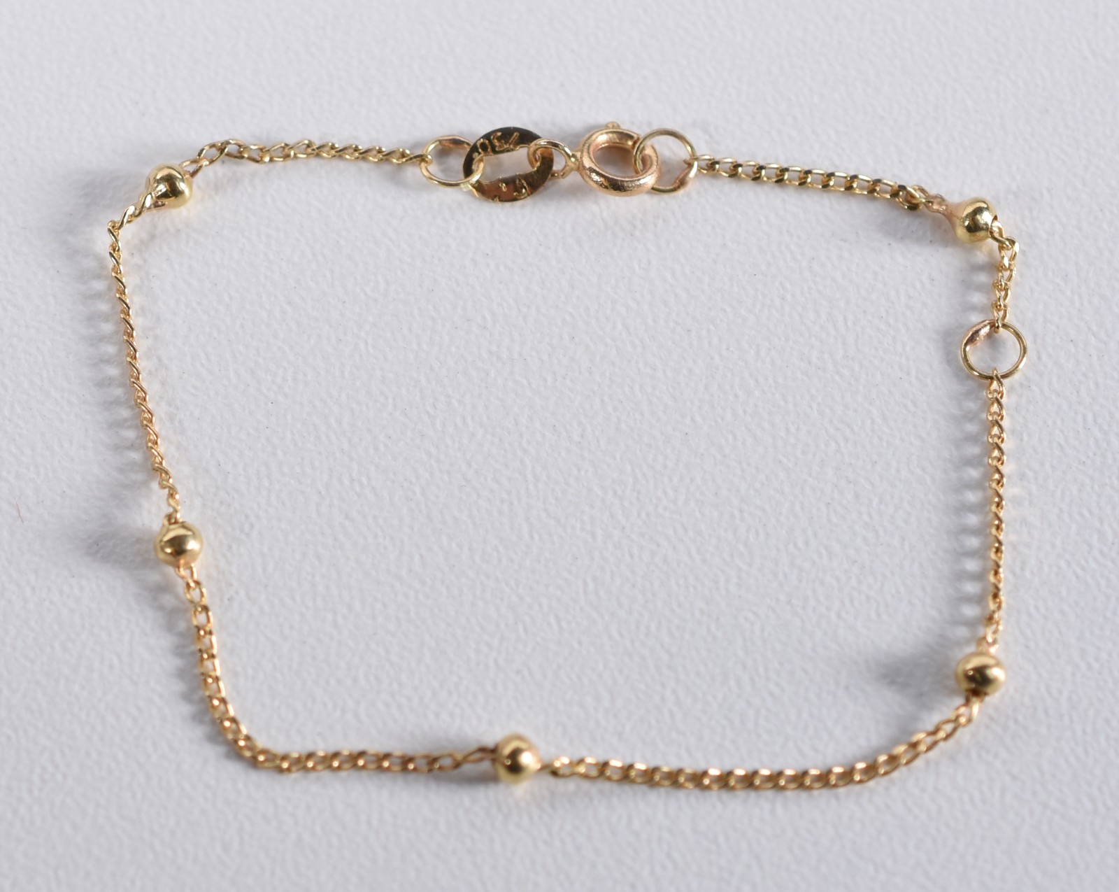 Pulseira de ouro 18k de criança com bolinhas (Por motivos de... - foto 2 de 3