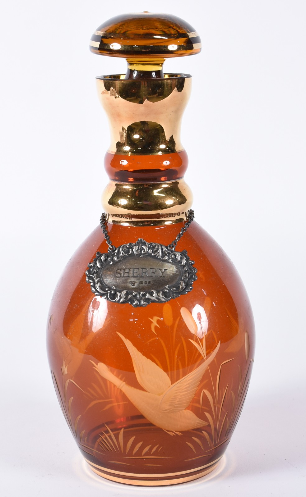 Garrafa de cristal na cor âmbar com pássaro lavrado e realces... - foto 1 de 5