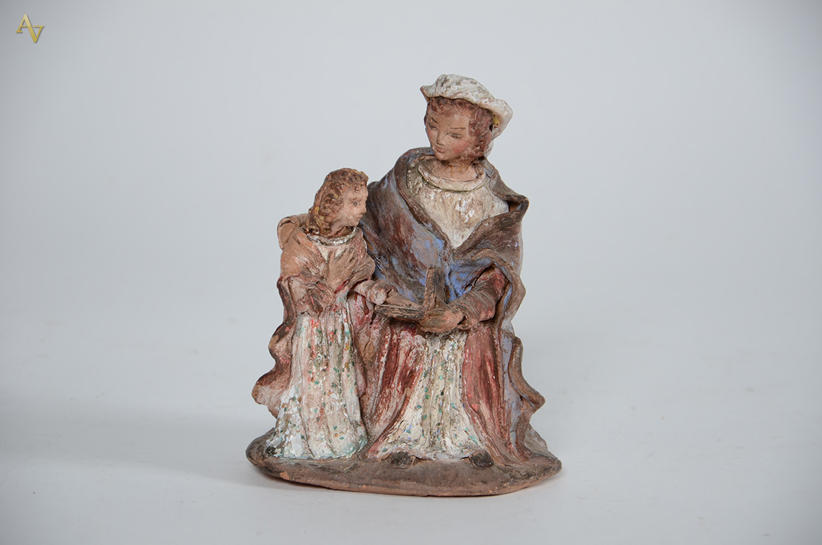 SANTANA MESTRA - Antiga imagem de terracota policromada. Alt. 15 cm.