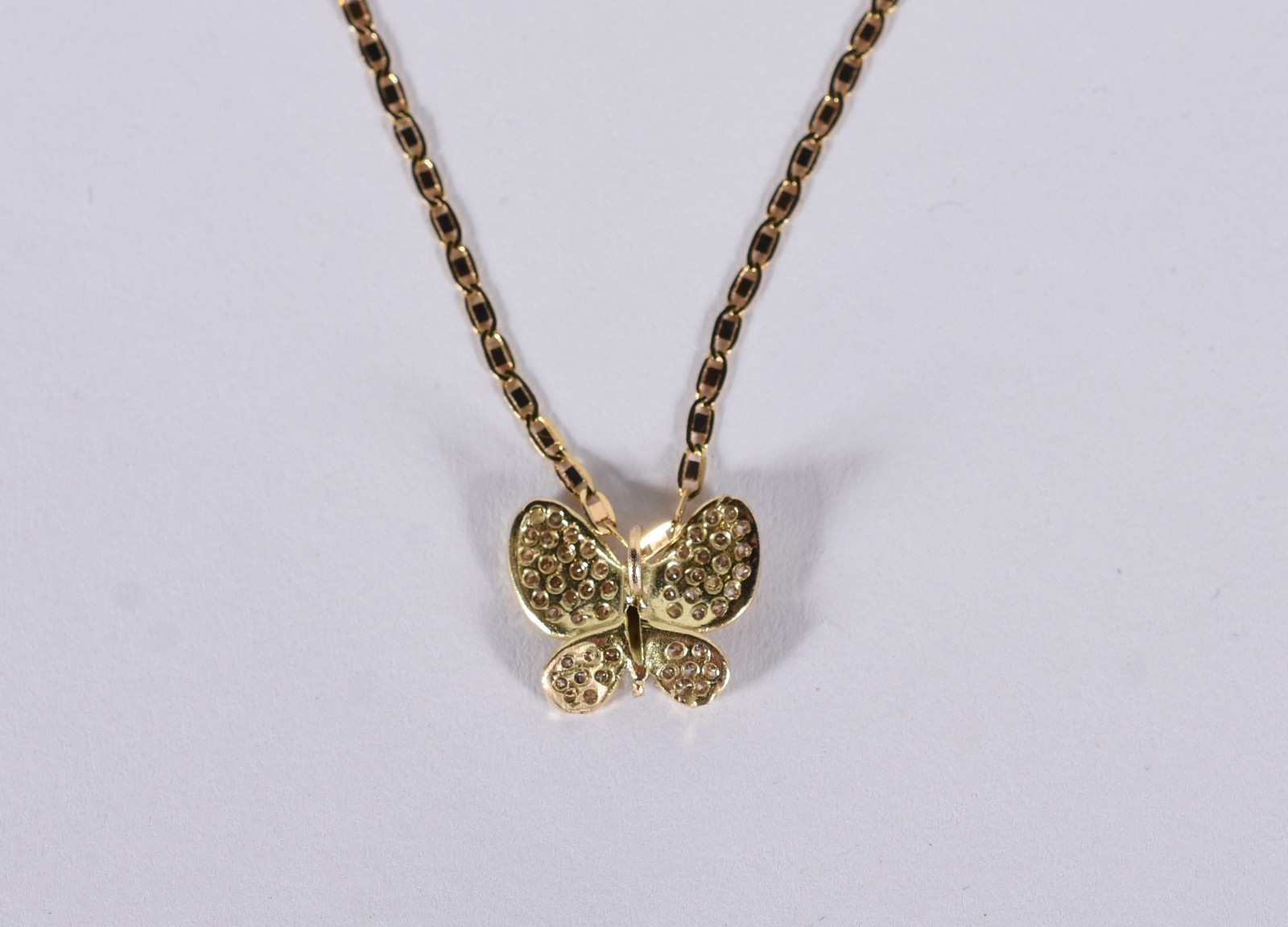Colar com pingente de ouro 18 k contraste 750 feitio borboleta... - foto 4 de 8